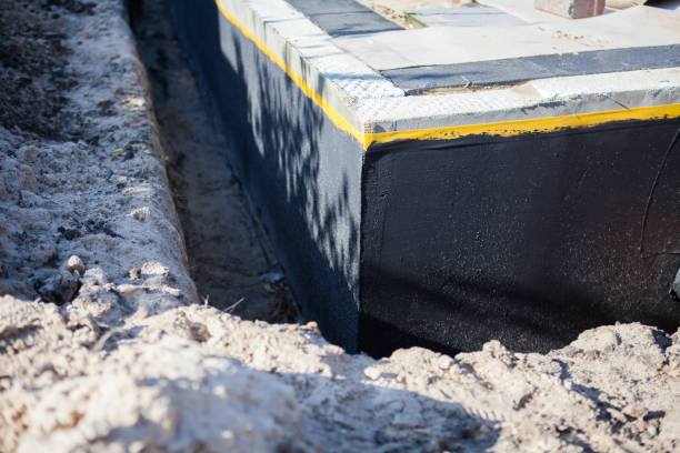 Professional Basement Waterproofing technician working in Lovettsville, VA